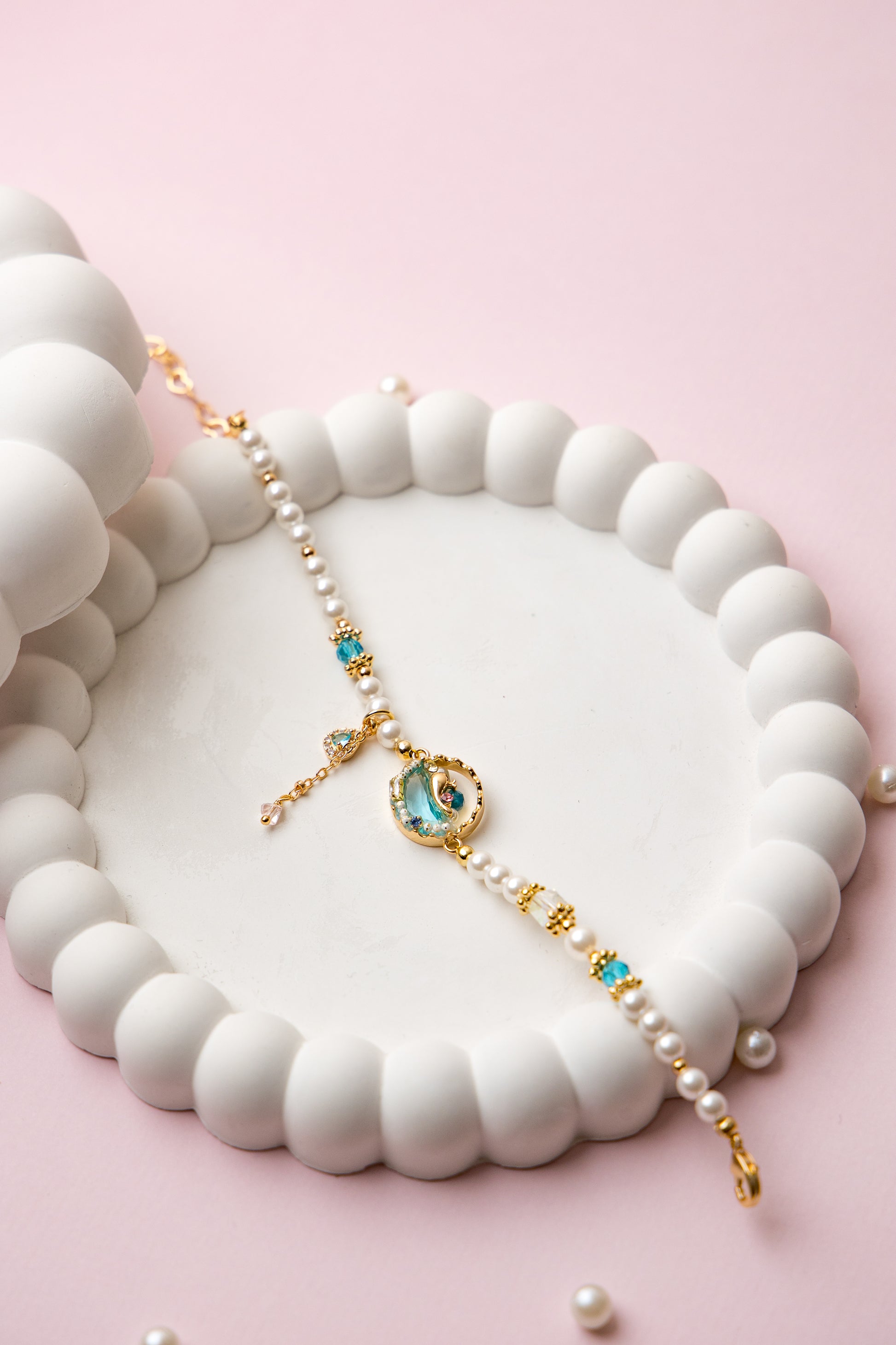 Dive into serenity with the Sea Muse Bracelet, a delicate blend of oceanic elegance and whimsical charm. 