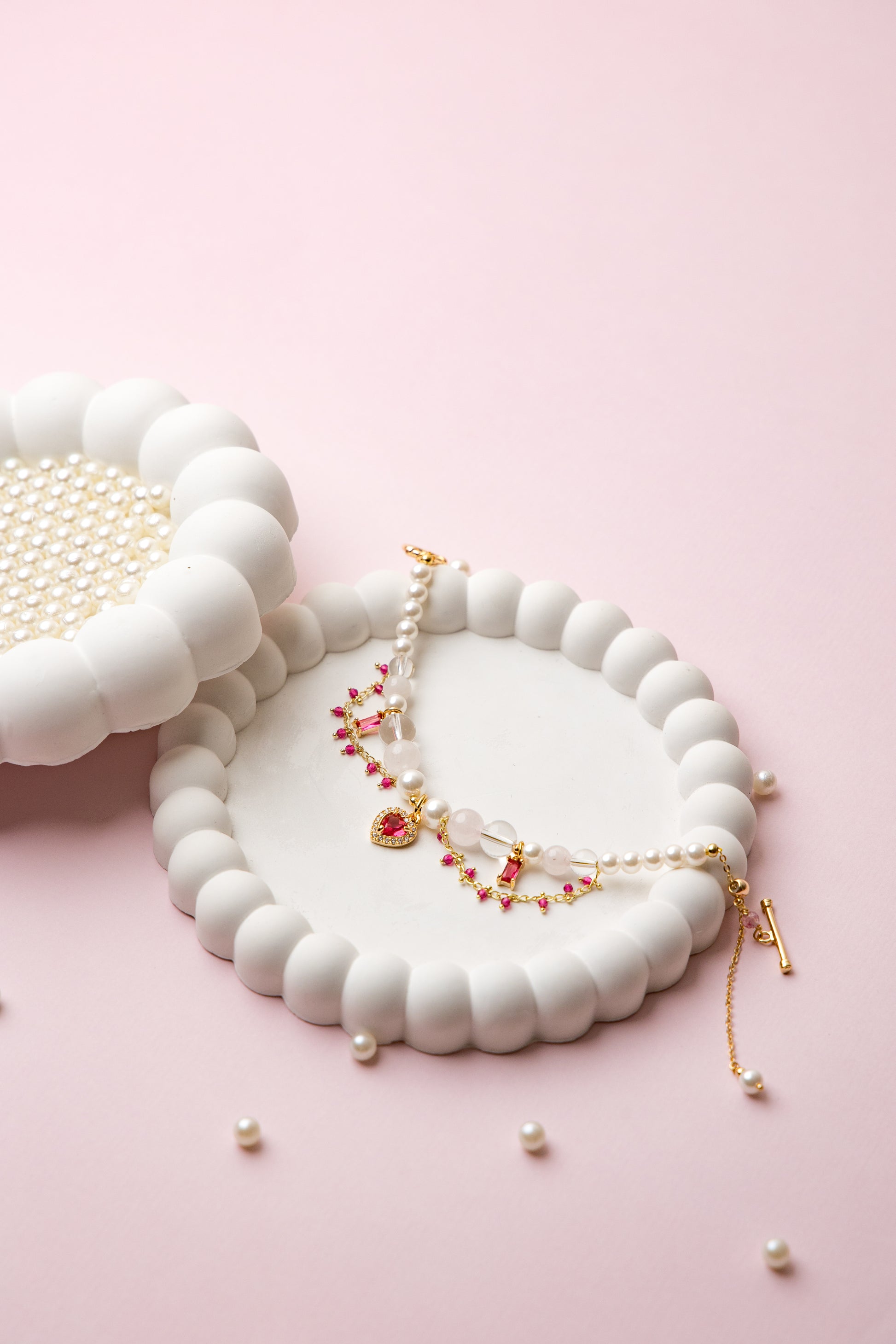 Romantic, refined, and delicately bold. With lustrous pearls, rose quartz beads, and a gold heart charm, Rosy Reverie captures soft luxury in every detail.