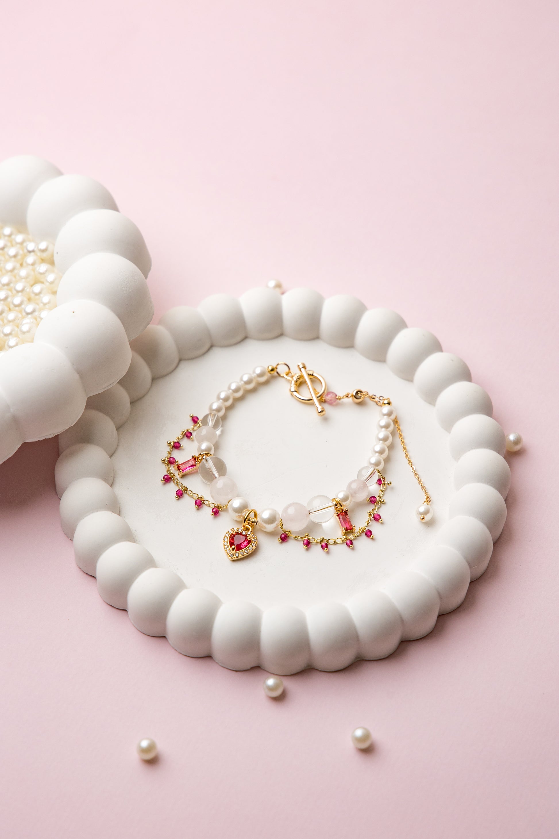 Romantic, refined, and delicately bold. With lustrous pearls, rose quartz beads, and a gold heart charm, Rosy Reverie captures soft luxury in every detail.