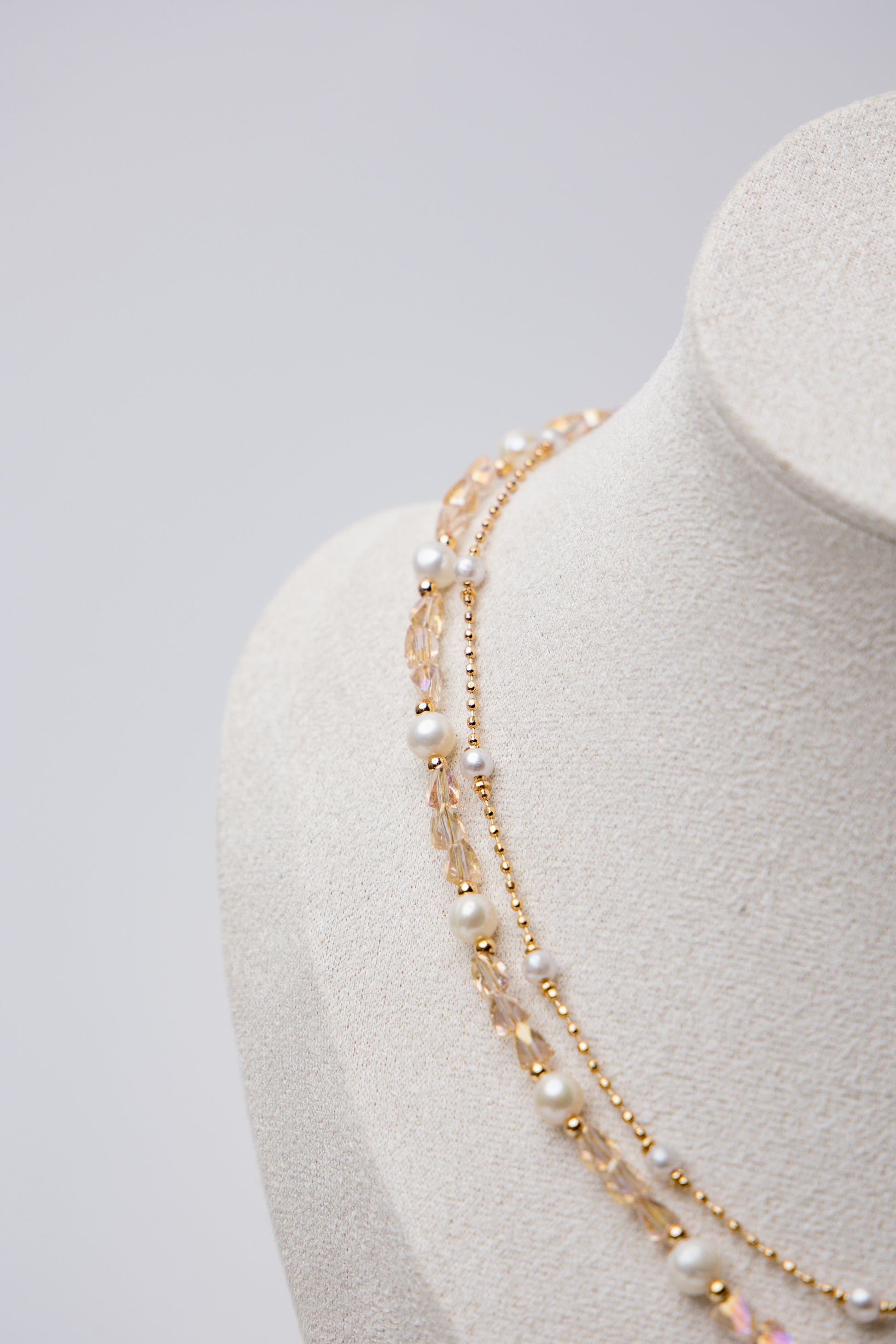 A dreamy blend of pearls, crystals, and butterfly charms for a whimsical touch.