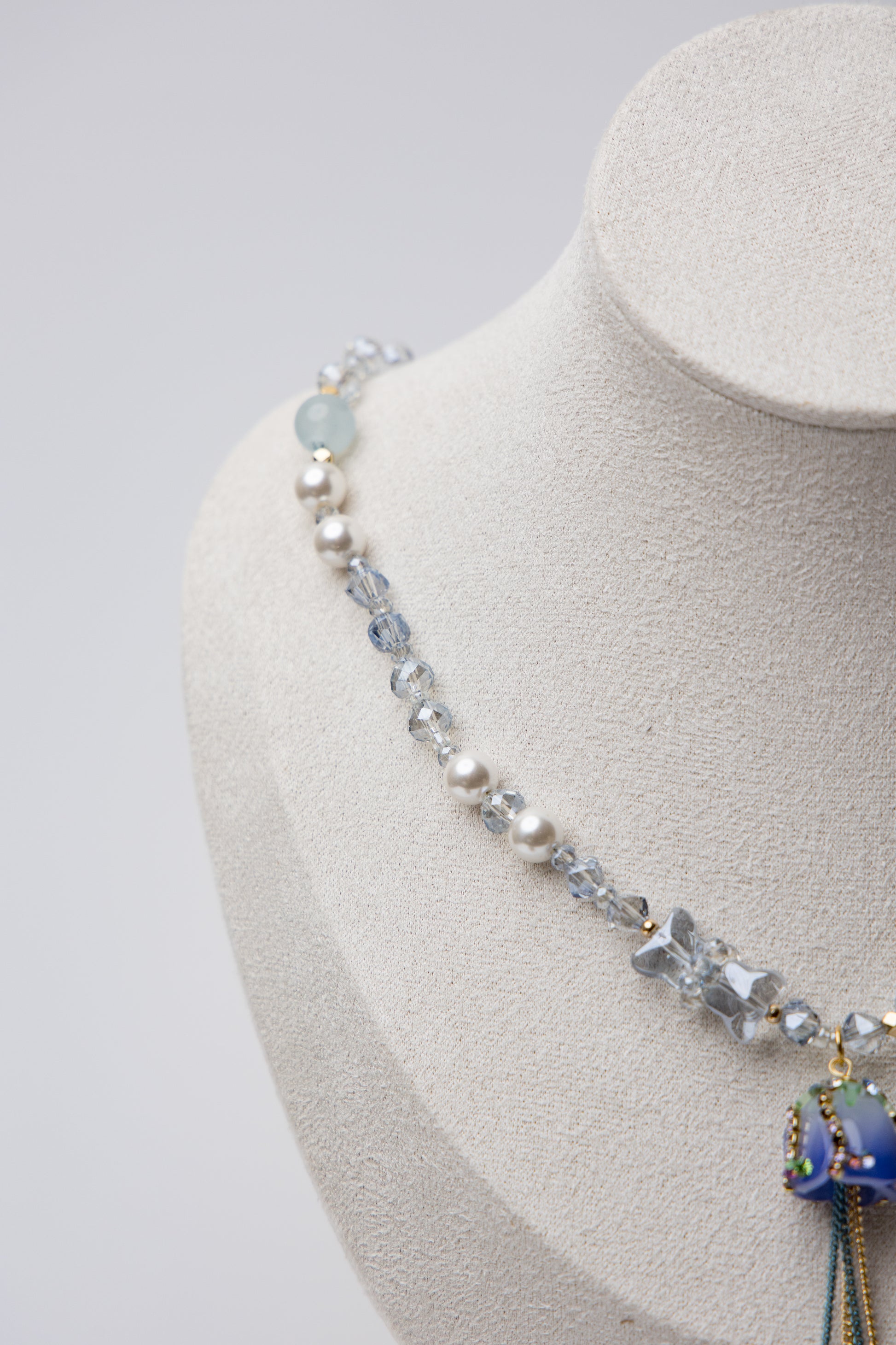 A dreamy floral-inspired necklace with pearls and a delicate rose charm. Adds a touch of whimsy and charm to your look.