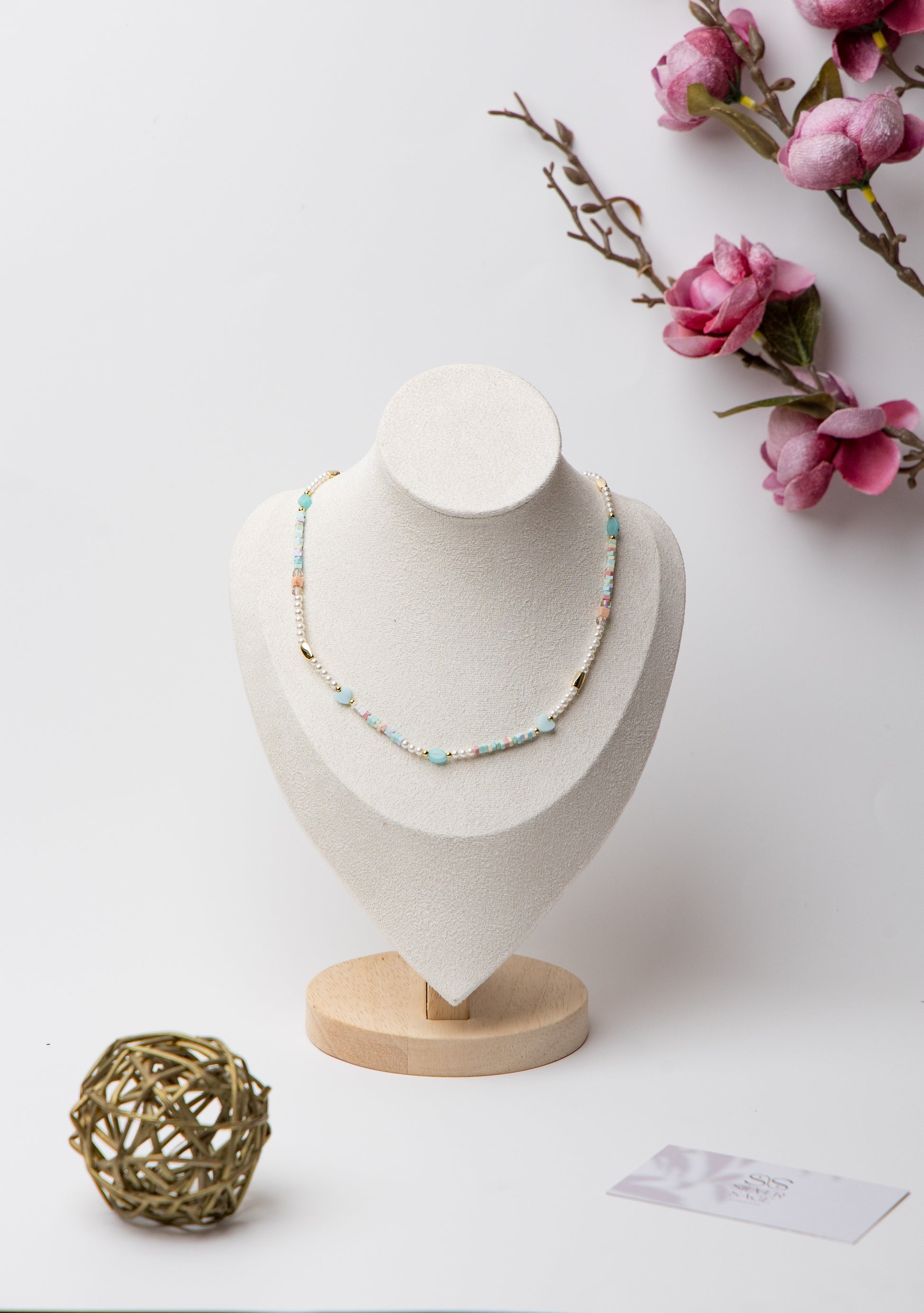 Pearl Glow Beaded Necklace in Ocean Blue featuring a calming blend of cool-toned blue beads and lustrous pearls, styled for an elegant yet playful look.