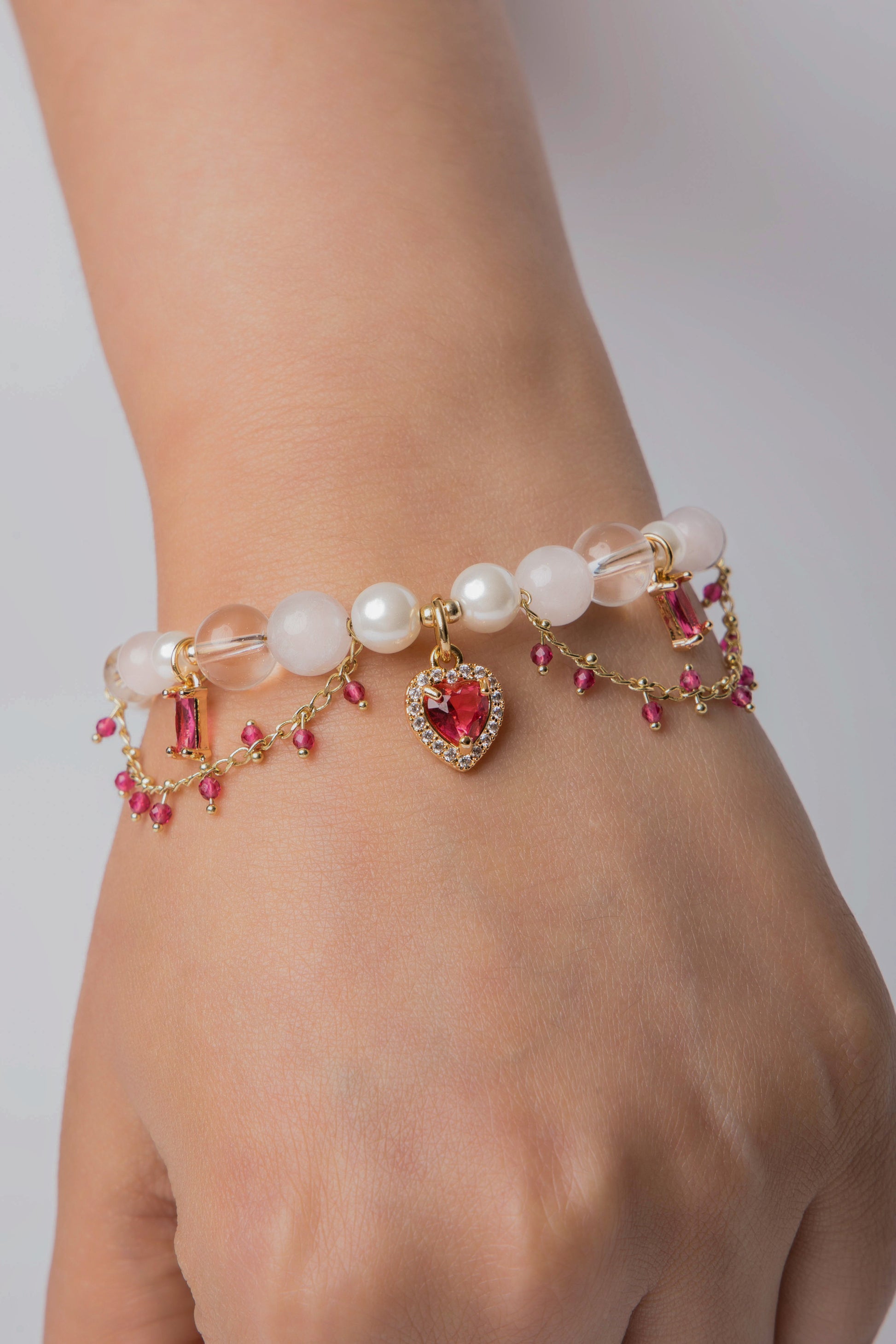 Romantic, refined, and delicately bold. With lustrous pearls, rose quartz beads, and a gold heart charm, Rosy Reverie captures soft luxury in every detail.