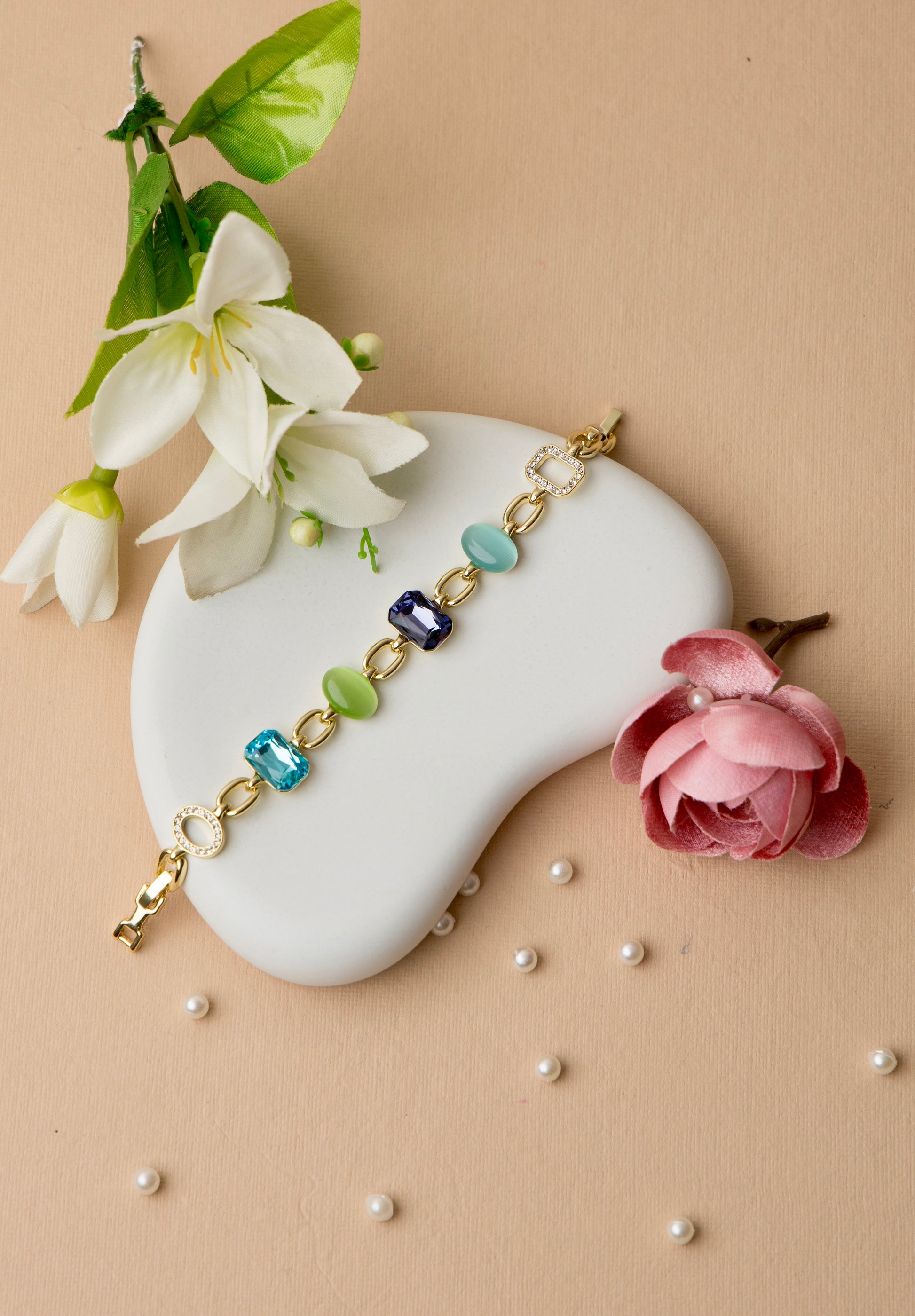 This bold crystal bracelet brings together amethyst and jade-toned resin with multicolor pops
