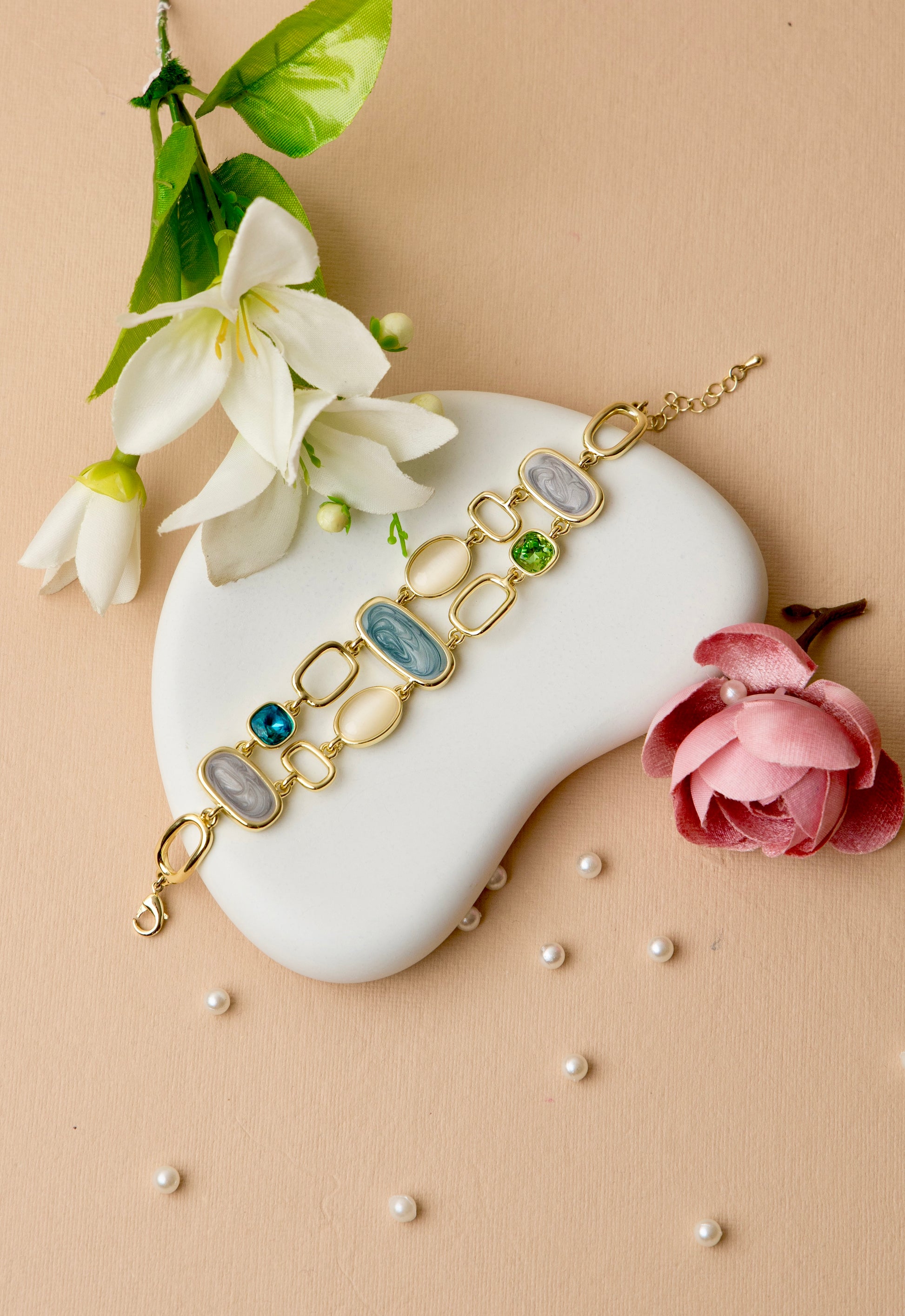 "Dual-strand bracelet with agate-inspired resin and crystal links, offering a luxe, layered look ideal for evening or festive wear."