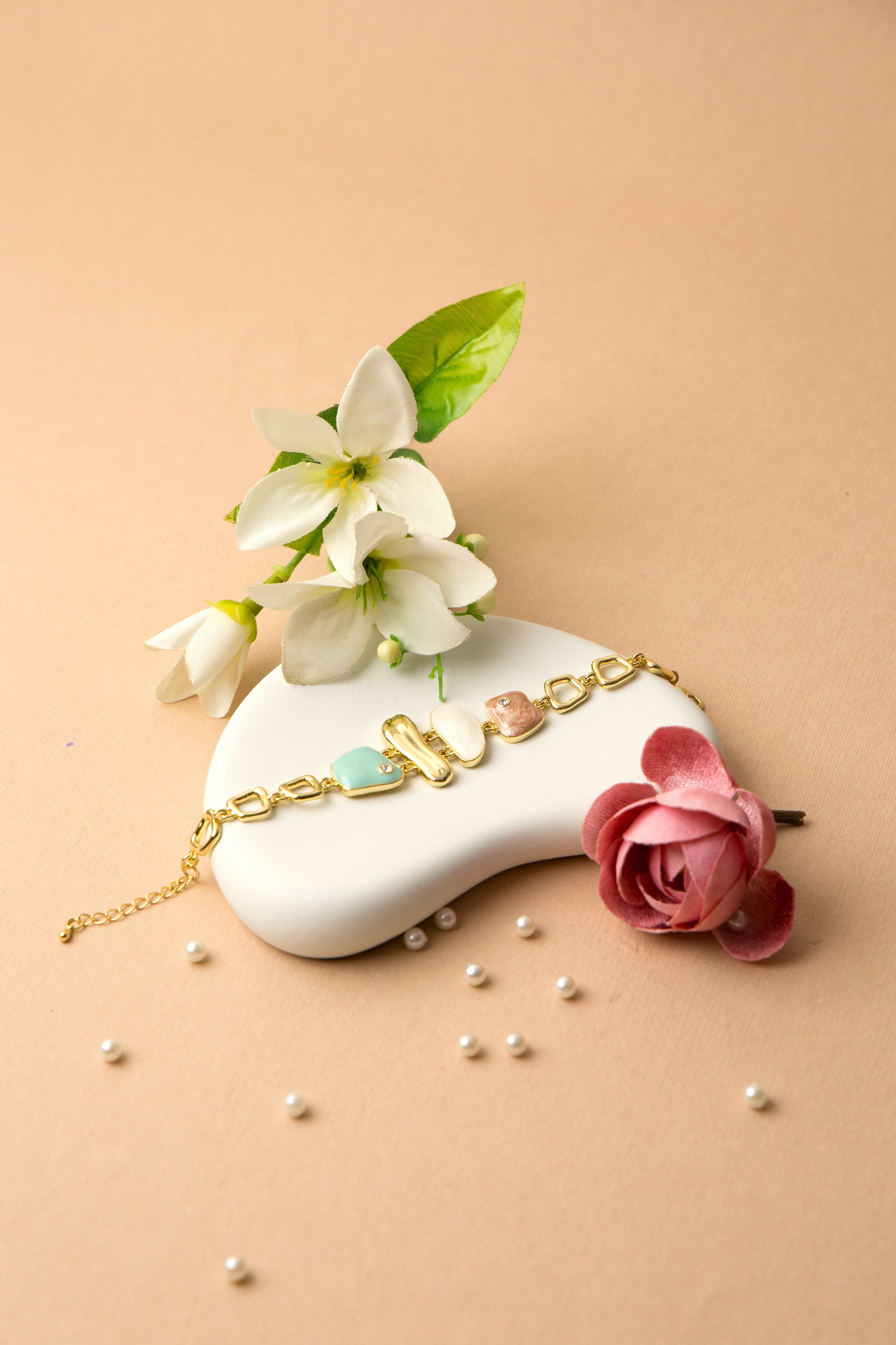 Soft mint green enamel charms make this bracelet ideal for casual looks, gifting, or brunch dates.