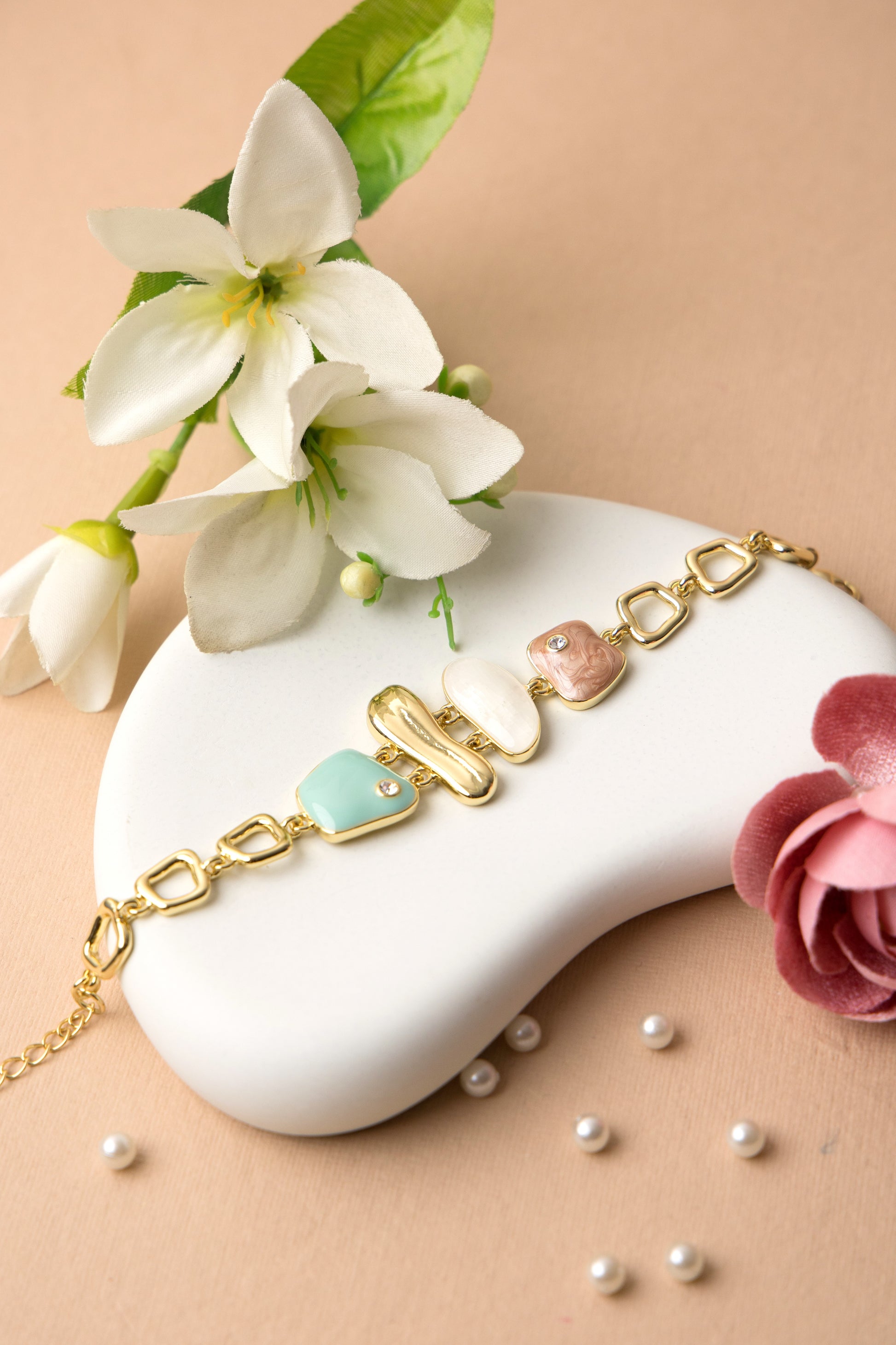Soft mint green enamel charms make this bracelet ideal for casual looks, gifting, or brunch dates.