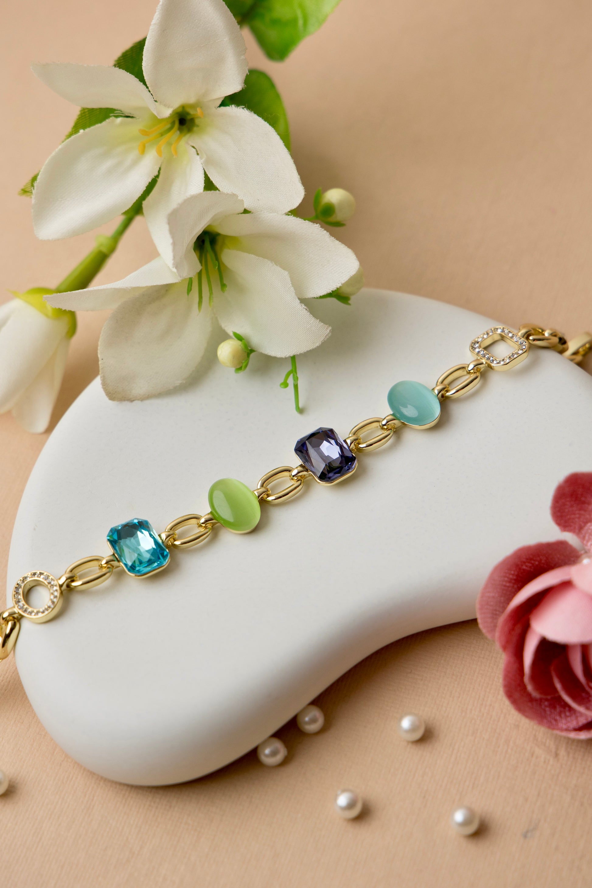 This bold crystal bracelet brings together amethyst and jade-toned resin with multicolor pops