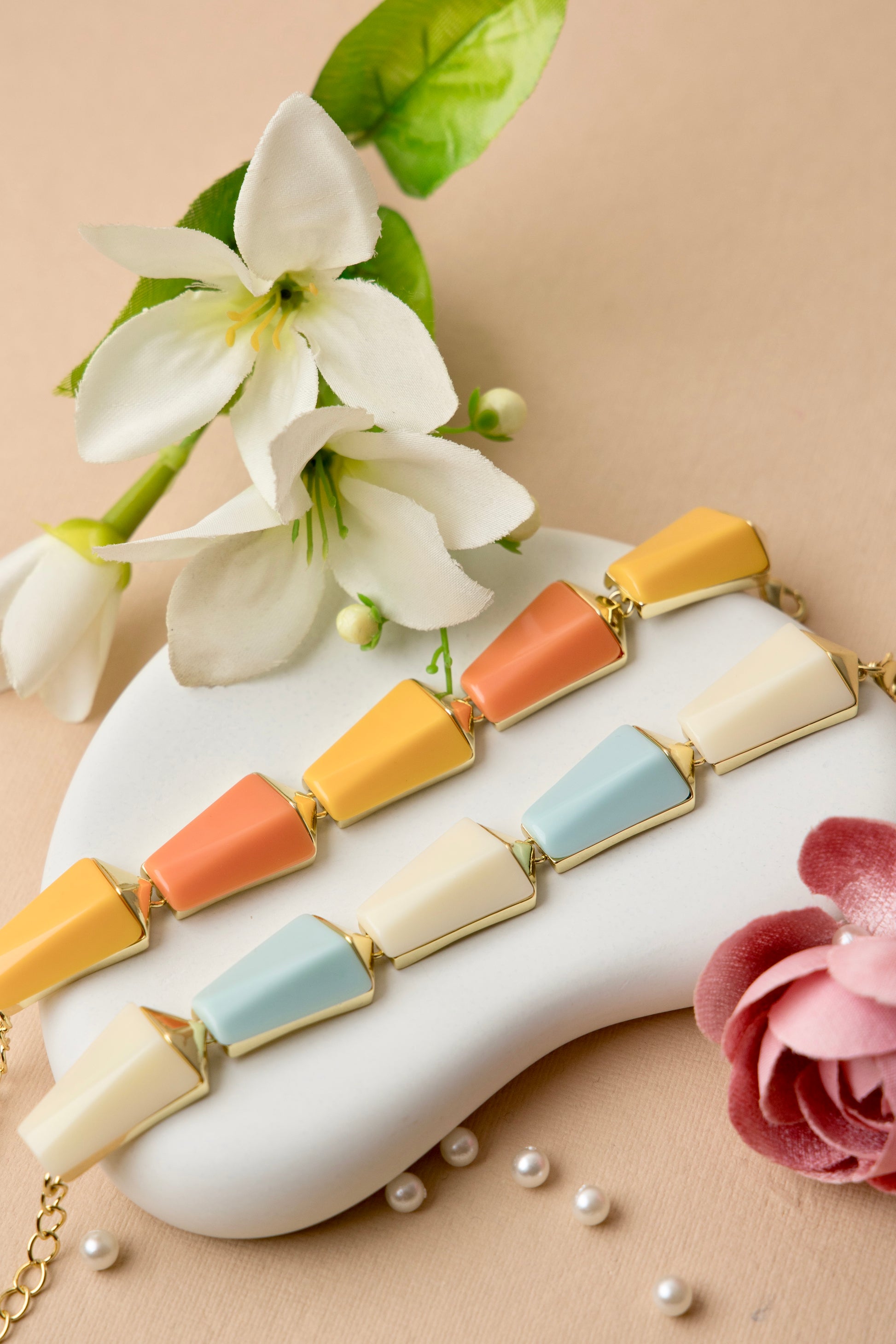 "Sky Prism Bracelet with cream and pastel blue color blocks in a sleek geometric design, blending modern angles with a soft, versatile palette."