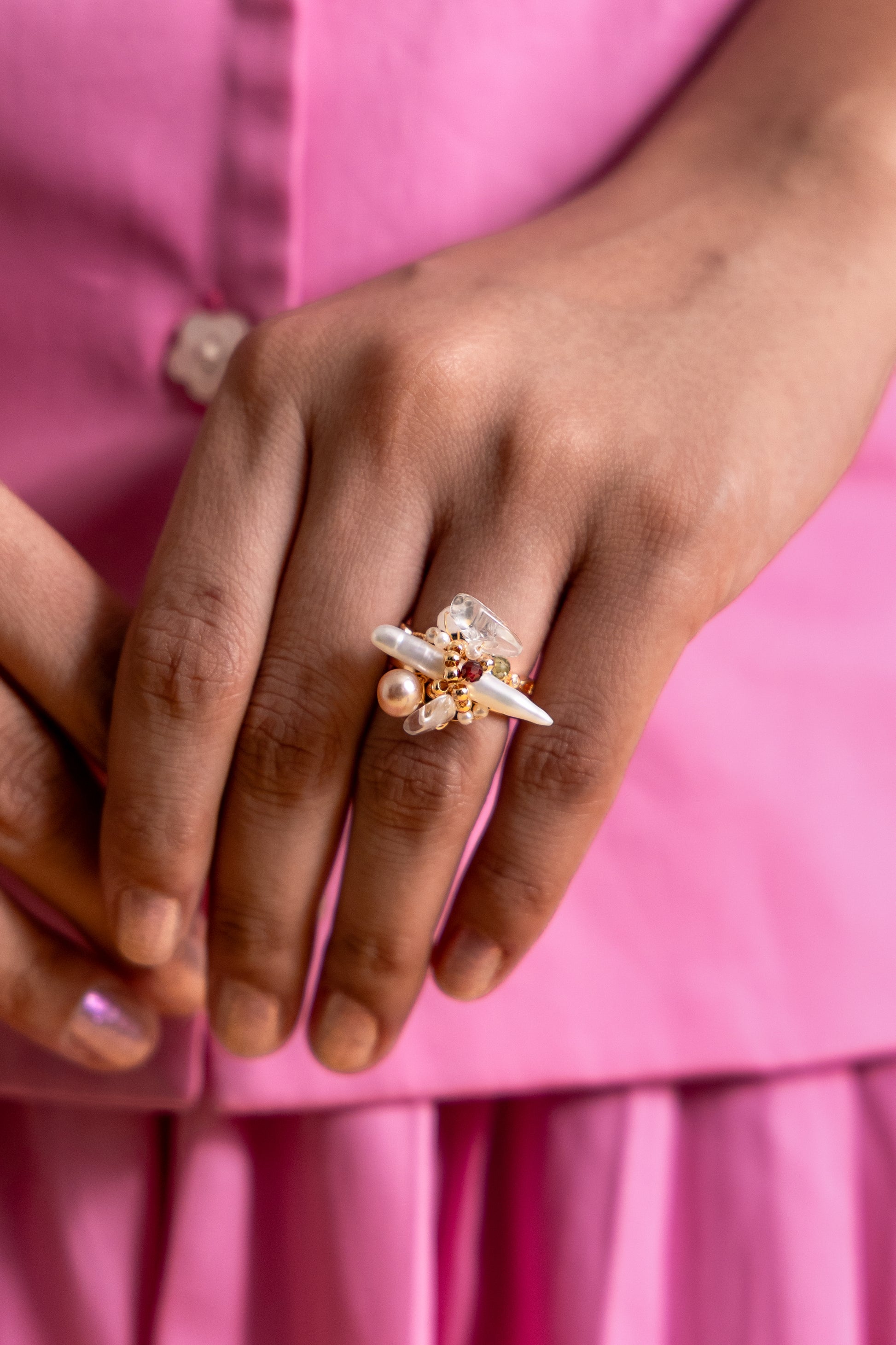 The Elysian Bloom Ring features a luminous fox pearl at its center, accented with a mix of soft pearls and delicate gemstones.
