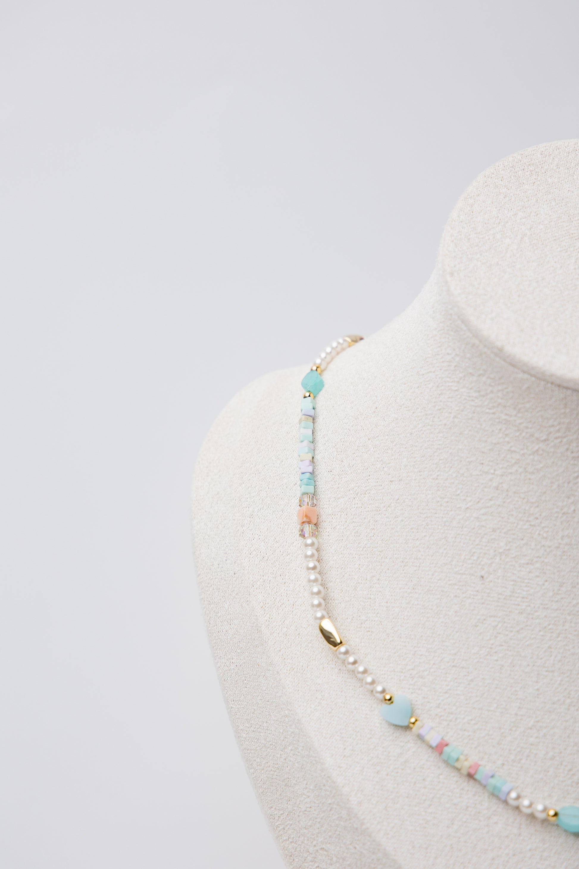 Pearl Glow Beaded Necklace in Ocean Blue featuring a calming blend of cool-toned blue beads and lustrous pearls, styled for an elegant yet playful look.