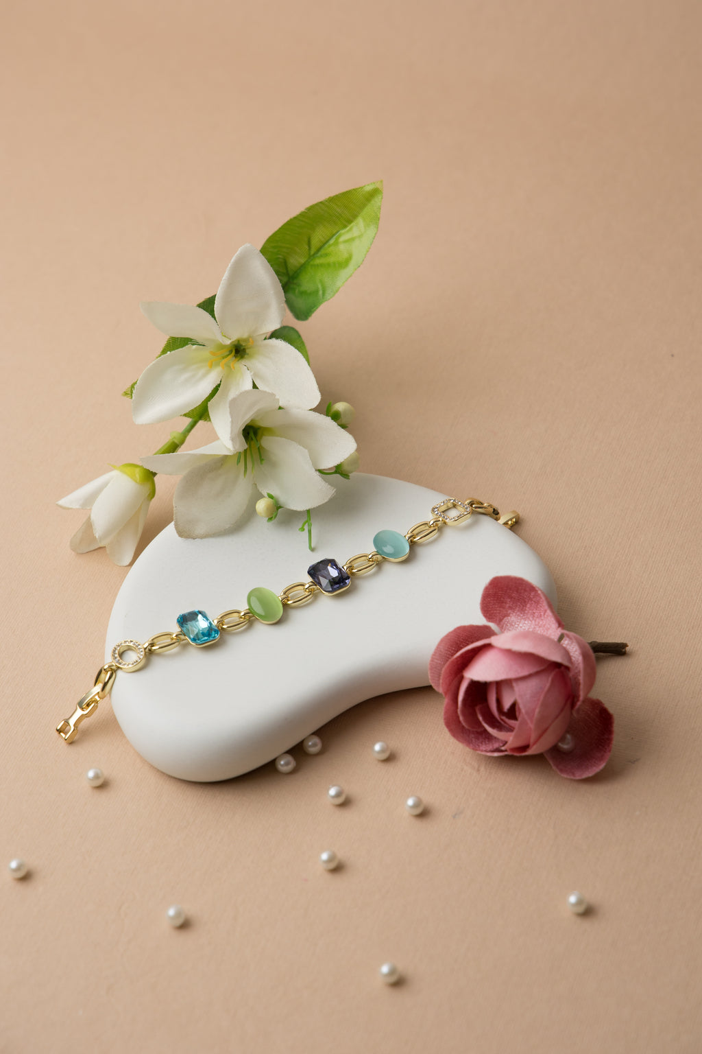 This bold crystal bracelet brings together amethyst and jade-toned resin with multicolor pops