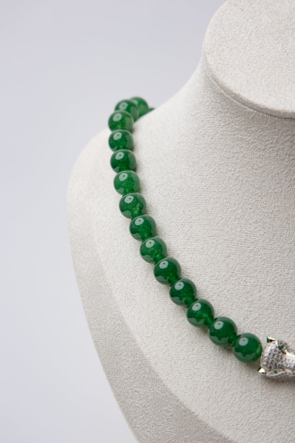 Make a fierce statement with bold jade beads and a panther clasp that exudes strength. An elevated piece with untamed energy