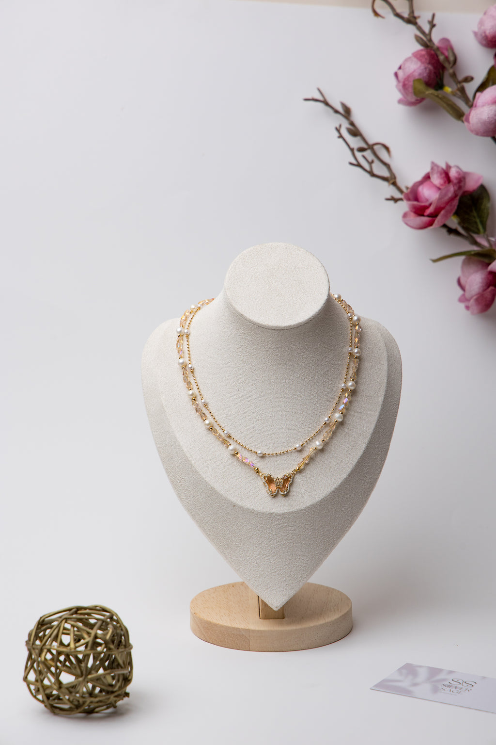 A dreamy blend of pearls, crystals, and butterfly charms for a whimsical touch.