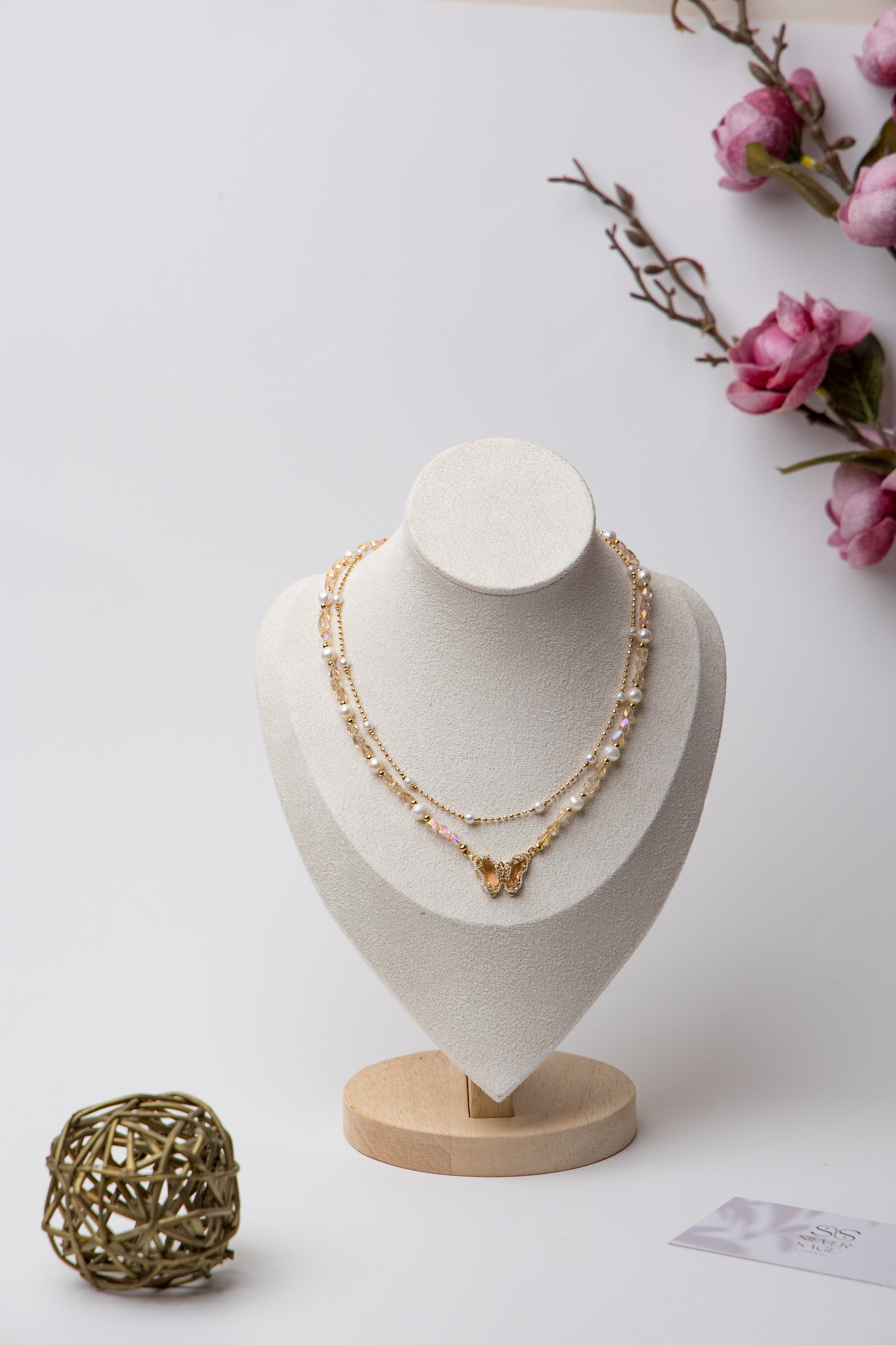 A dreamy blend of pearls, crystals, and butterfly charms for a whimsical touch.