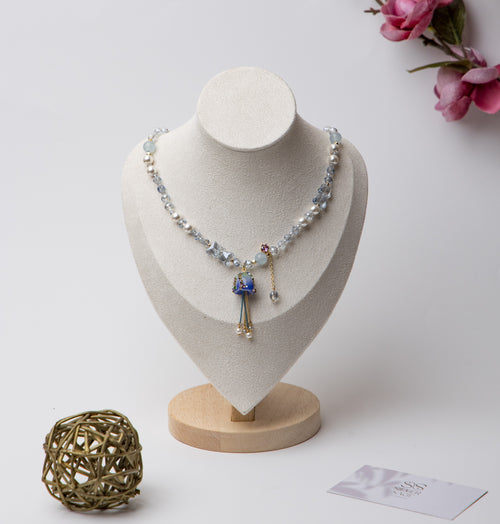 A dreamy floral-inspired necklace with pearls and a delicate rose charm. Adds a touch of whimsy and charm to your look.