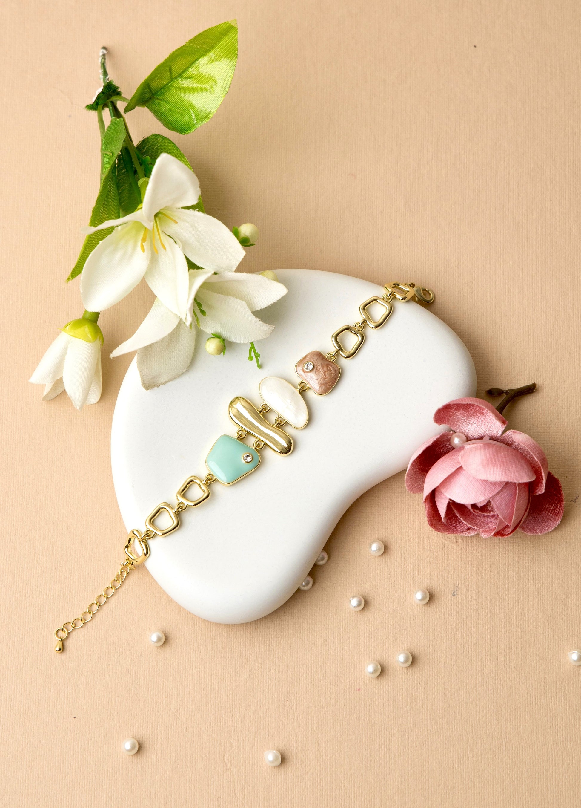 Soft mint green enamel charms make this bracelet ideal for casual looks, gifting, or brunch dates.