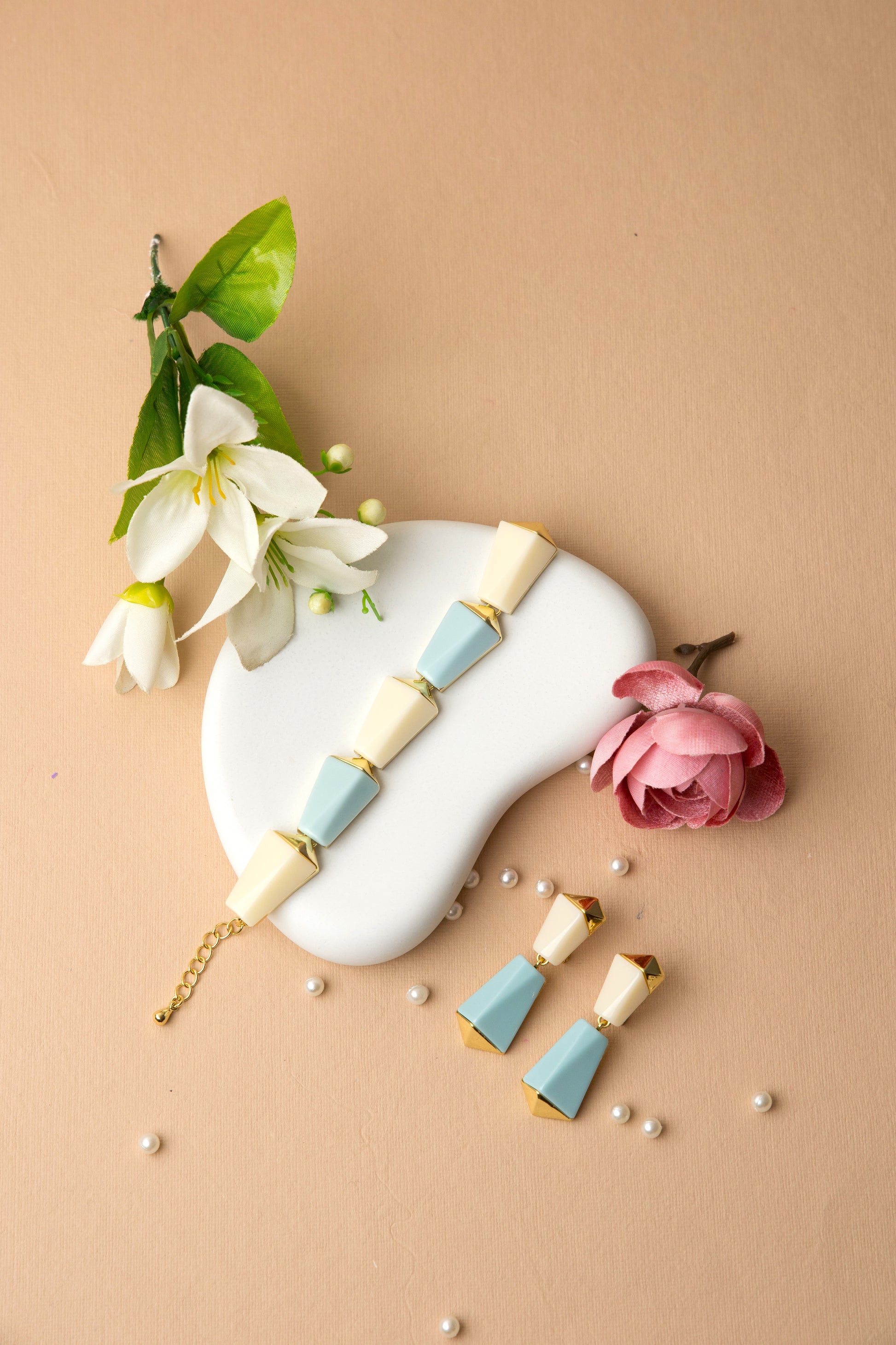 "Sky Prism Bracelet with cream and pastel blue color blocks in a sleek geometric design, blending modern angles with a soft, versatile palette."