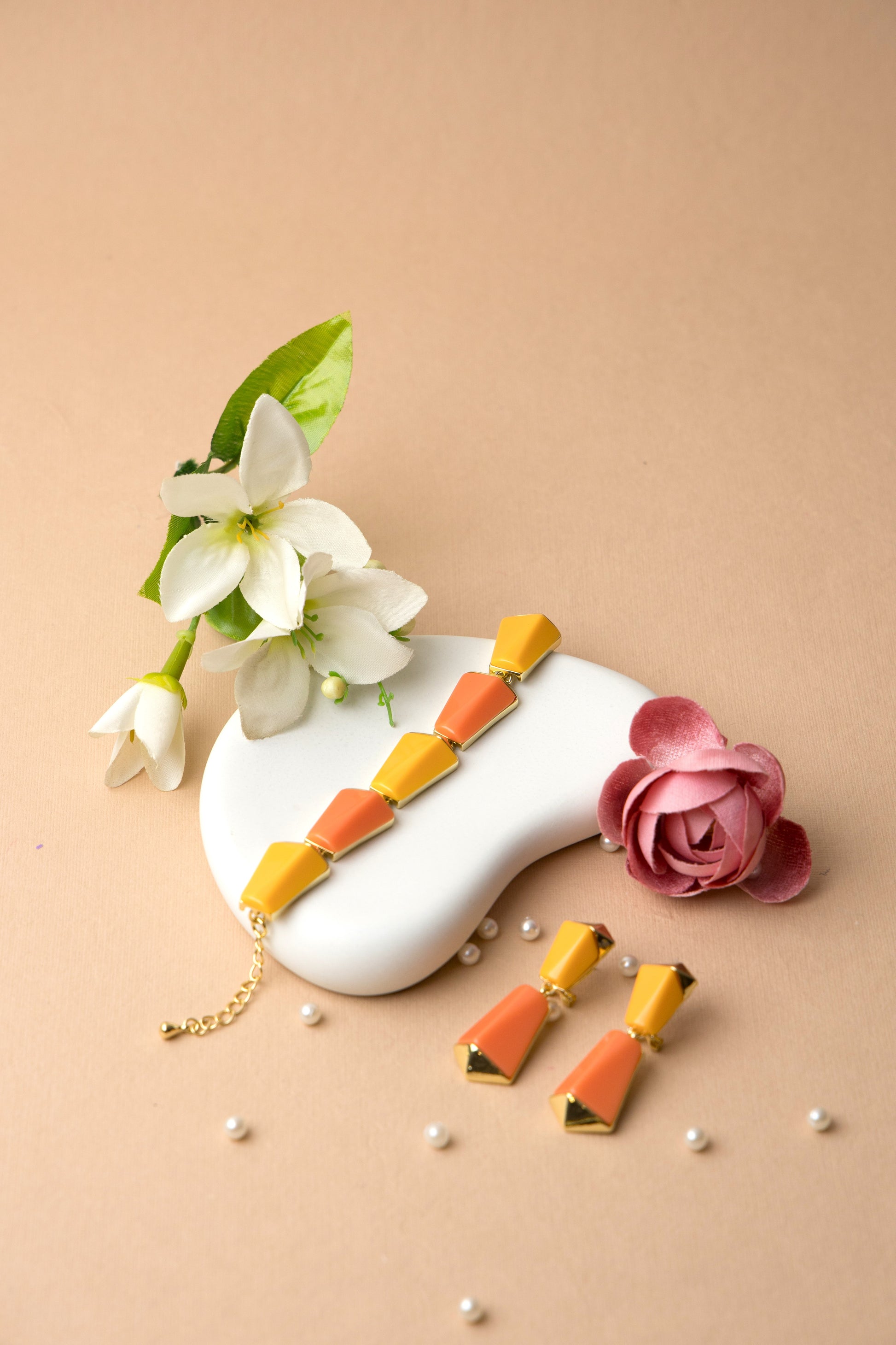 "Sunset Prism bracelet with bold orange and yellow tones in a prism-inspired design, accented with gold, perfect for summer outfits or vacations."