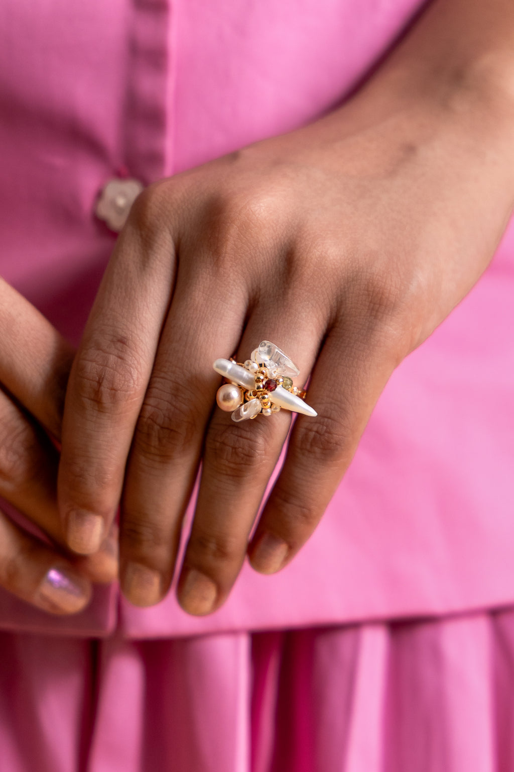 The Elysian Bloom Ring features a luminous fox pearl at its center, accented with a mix of soft pearls and delicate gemstones.